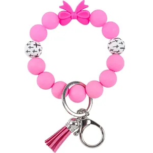 Levendig roze siliconen kralen sleutelhanger armband met strik en stijlvolle PU lederen kwast