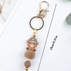 Cartoon cow silicone bead keychain with fur ball and 5.91 inch length marker
