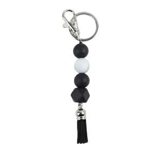 Minimalist black and white silicone bead keychain with octagonal bead and tassel charm