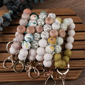 Handmade silicone beaded wristlet keychain with floral and wooden print DIY beads