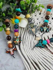 Handmade Western cowboy style silicone beaded keychains with bull skull and cowboy hat charms