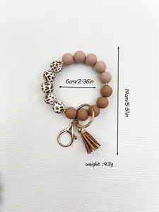 Detailed close-up of silicone bead wristlet keychain showing dimensions and weight.