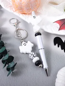 Macro view of Halloween ghost silicone bead keychain and matching beaded ballpoint pen