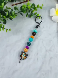 Western style keychain featuring bull head pendant and colorful beads with cowboy hat.
