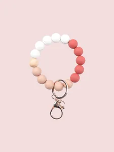 Detailed macro view of candy-colored silicone and wood bead wristlet keychain accessory