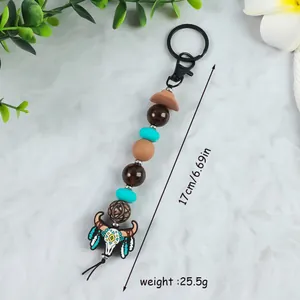 Boho western cowboy style beaded keychain with bull skull pendant and mini hat charm