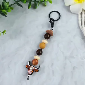 Handmade Western cowboy style bull head beaded keychain with brown cowboy hat charm