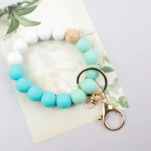 Candy color silicone beaded keychain wristlet with marble patterns and wooden bead charm.