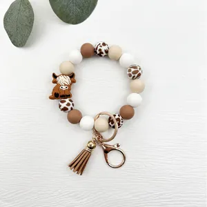 Highland cow silicone bead wristlet keychain with leather tassel and gold hardware