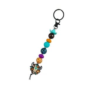 Handmade western cowboy bull skull beaded keychain with mini turquoise hat charm