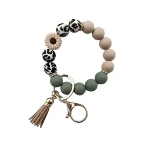 Stylish daisy silicone bead wristlet keychain with leopard pattern and brown tassel