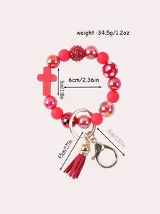 Red silicone beaded keychain with cross charm and tassel detail dimensions included