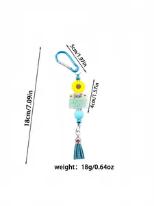 Dimension detail showing length and weight of the silicone daisy tassel keychain