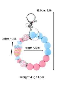 Detailed view of colorful silicone bead keychain showing 13cm height and weight specifications