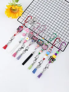 Llaveros de cuentas de silicona con dijes de enfermera y borlas para bolsos.