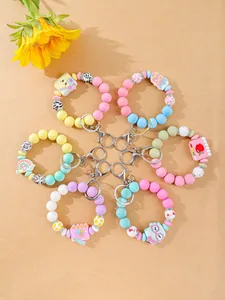 Detailed view of colorful pastel silicone bead keychain bracelets with cute charms