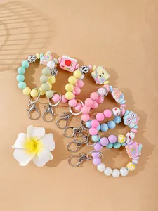 Collection of cute silicone bead wristlet keychains with various colorful cartoon charms