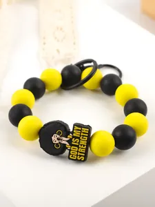 Detail of silicone bead keychain featuring a God Is My Strength charm in black and yellow.