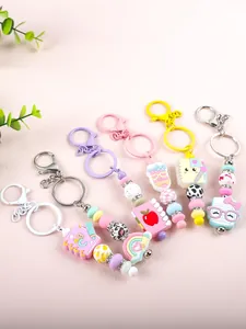Collection of colorful beaded silicone keychains with cute notebook and rainbow charms