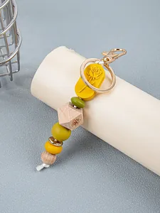 Detailed close-up of colorful silicone and wooden beads on a rose keychain pendant