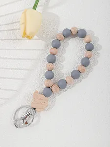 Detail view of a beaded wristlet keychain with gray silicone and wooden beads.