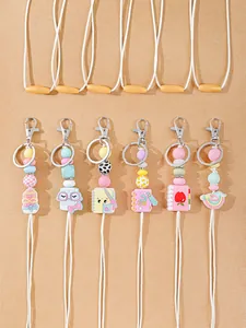 Close-up of colorful cute silicone keychain lanyards with various school-themed charms