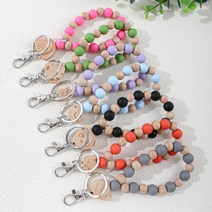 Handmade colorful silicone and wooden beaded wristlet keychains with engraved cat charms