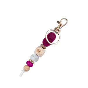 Rose floral silicone and natural wooden bead keychain with butterfly engraving for bags