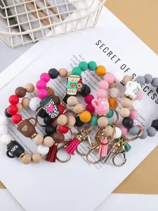 Colorful silicone and wooden bead keychain bracelets with cute coffee mug charms.