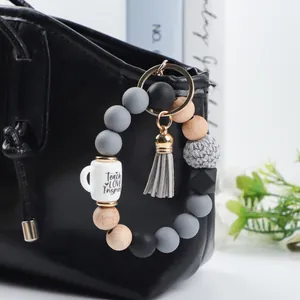 Silicone bead wristlet keychain with wood bead and Teach Love Inspire cup charm