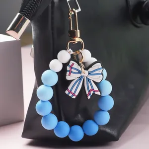 Food grade silicone beaded keychain bracelet with blue gradient beads and bow