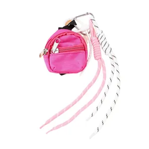 Porte-clés mini sac à dos rose tendance avec pendentifs décoratifs en corde tressée