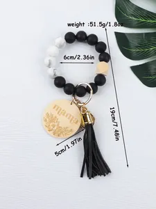 Detailed measurements of silicone bead keychain wristlet with mama wood charm and tassel