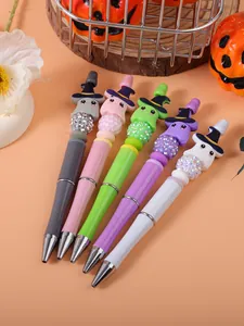 Detail view of colorful beadable pens with cute Halloween ghost and witch hat toppers