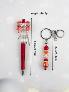 Detailed view of red bow beaded pen and matching keychain set with dimensions.
