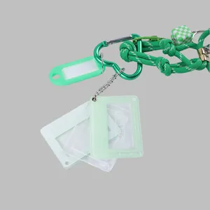 Detailed view of DIY heart-shaped keychain with mini cassette tape photo frames