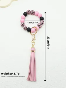 Detailed view of silicone bead wristlet keychain with pink PU tassel and dimensions