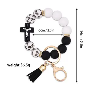 Detailed product size and weight specification for beaded cross keychain with tassel