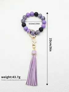 Detailed view of purple silicone beaded wristlet keychain with size and weight info