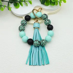 Leopard print silicone beaded wristlet keychain with matching teal PU tassel