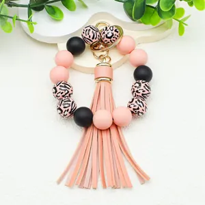 Leopard print silicone bead bracelet keychain with pink PU tassel and gold hardware