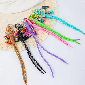 Colorful handmade braided paracord keychains with cute silicone charms in various styles