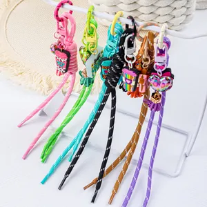 Macro view of vibrant handmade silicone keychains with woven ropes and cute charms