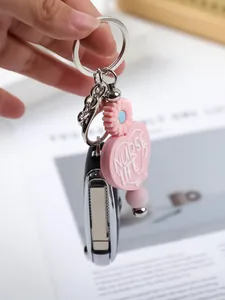 Close-up of pink heart silicone keychain with 'Nurse Life' text and daisy flower