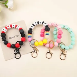 Niedlich Silikon Perlen Schlüsselanhänger Armband Liebe Briefe Leuchtende Perlen Lächeln Gesicht Fledermaus Schleife Anhänger Legierung Verschluss