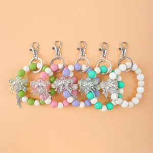 Eleganter bunter Silikon-Perlen-Schlüsselanhänger mit Strass-Schleife und Quasten-Anhänger