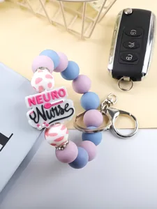 Close-up of "NEURO Nurse" silicone beaded keychain with colorful beads and silver clasp