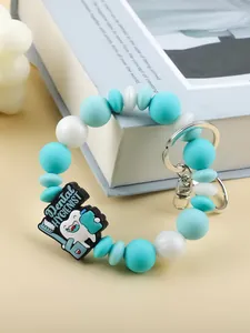 Macro view of silicone beaded keychain with a cute Dental Hygienist cartoon tooth charm