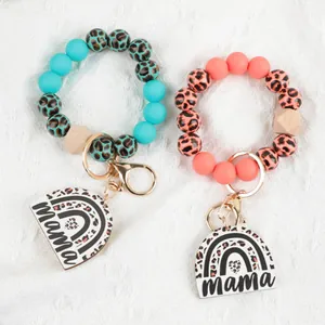 Stylish leopard silicone bead wristlet keychain set featuring mama rainbow pendant