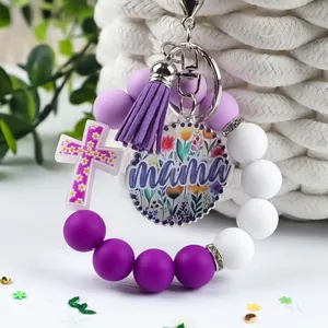 Silicone bead keychain bracelet with purple tassel and floral mama charm for women.